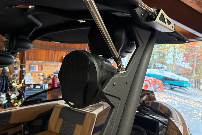 Slide: The Image of 2022 Malibu Wakesetter 25 LSV boat interior with mounted speaker system. - 18