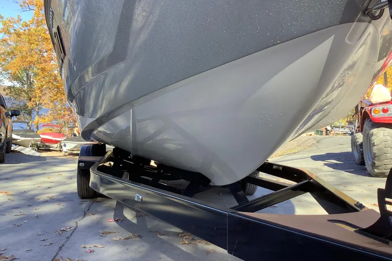 Slide: The Image of 2022 Malibu Wakesetter 25 LSV boat on trailer, autumn background. - 6