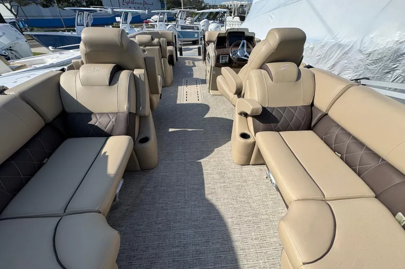 Slide: The Image of Luxurious 2022 Blue Wave Pontoon boat interior with plush seating and modern steering console. - 5
