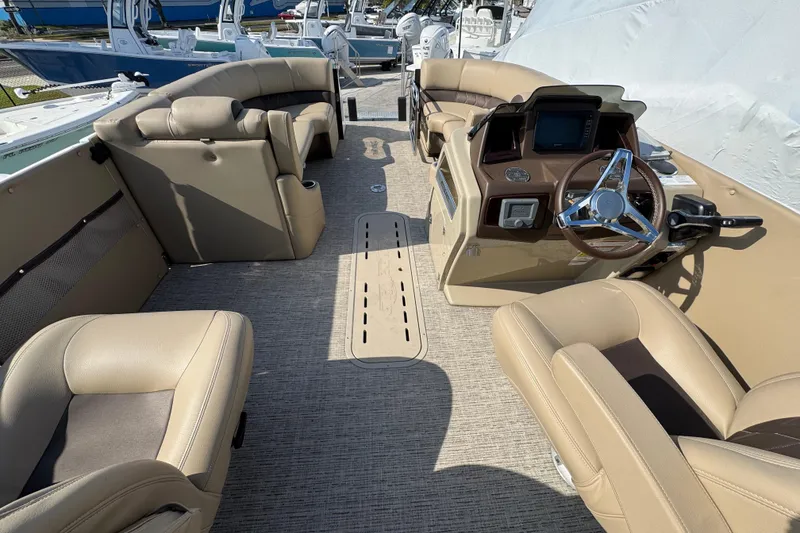 Slide: The Image of 2022 Blue Wave Pontoon boat interior with luxurious tan seating and modern design. - 6