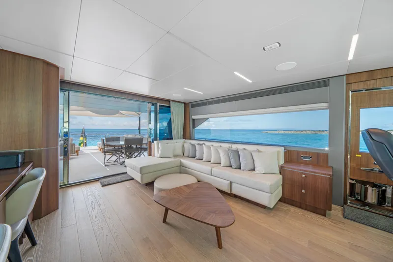 Slide: The Image of Luxurious 2023 Horizon FD90 yacht interior with ocean view, modern decor, and spacious seating. - 24