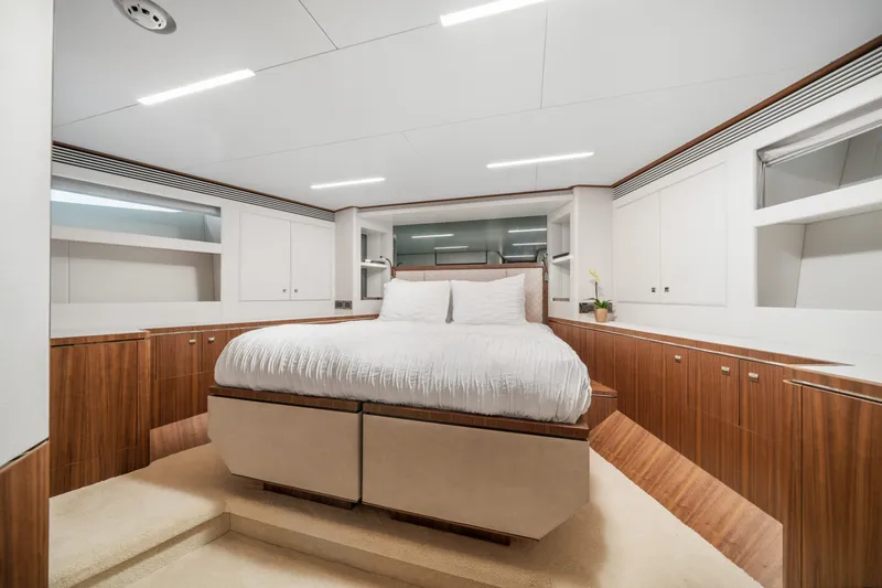 Slide: The Image of Luxurious bedroom interior of 2023 Horizon FD90 yacht with modern design and wood accents. - 18