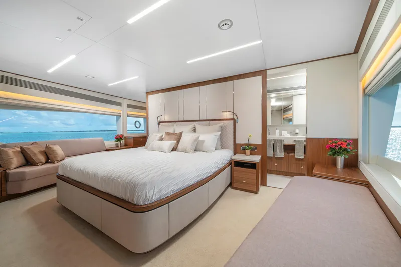 Slide: The Image of Luxurious 2023 Horizon FD90 yacht bedroom with ocean view, elegant decor, and modern amenities. - 16