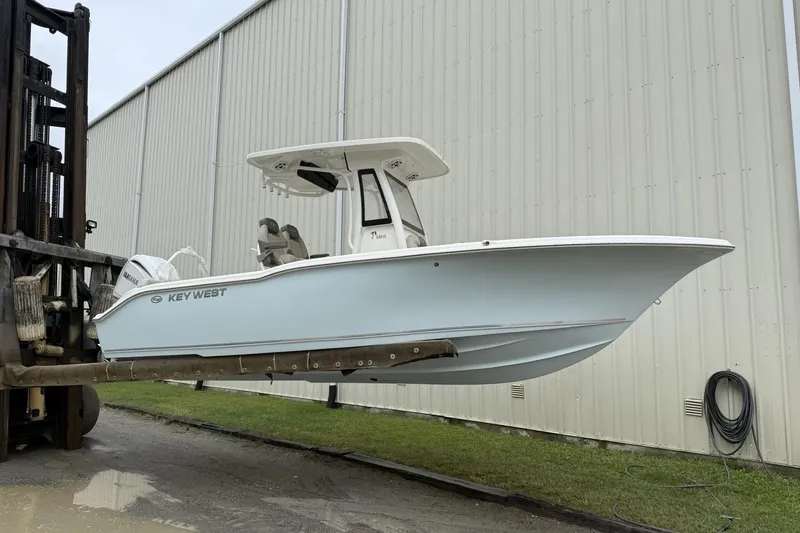 The Image of 2026 Key West 239 FS boat on trailer under clear blue sky. - 0