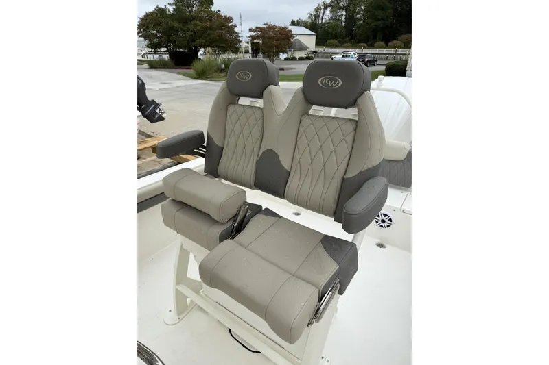 Slide: The Image of 2026 Key West 239 FS boat interior with seating and console, featuring modern design. - 4