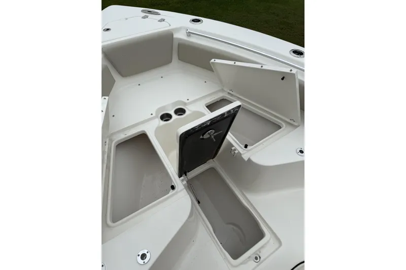 Slide: The Image of 2026 Key West 239 FS boat interior with storage compartments and seating area. - 8