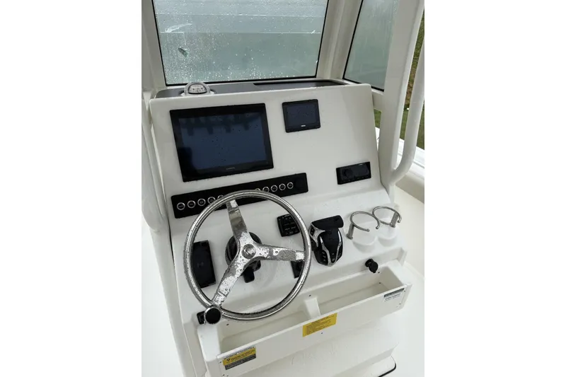 Slide: The Image of Open storage compartments on 2026 Key West 239 FS boat deck. - 9