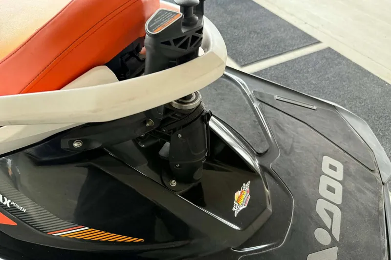 Slide: The Image of 2018 Seadoo GTI SE 155 jet ski with orange seat and black body. - 14