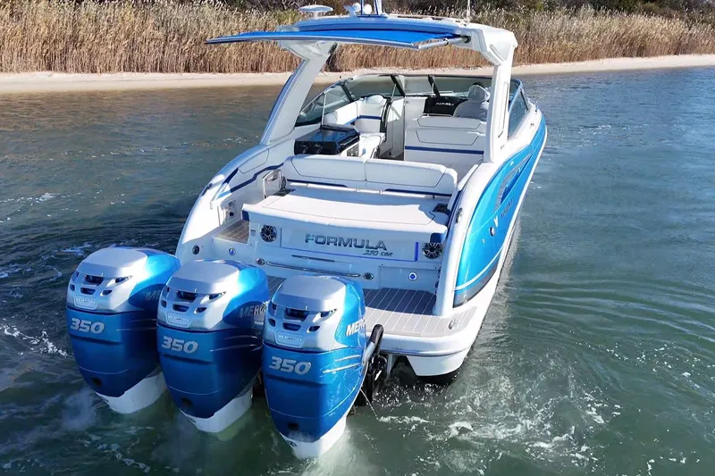 Slide: The Image of 2019 Formula 350 Crossover Bowrider OB with triple Mercury engines on water. - 1