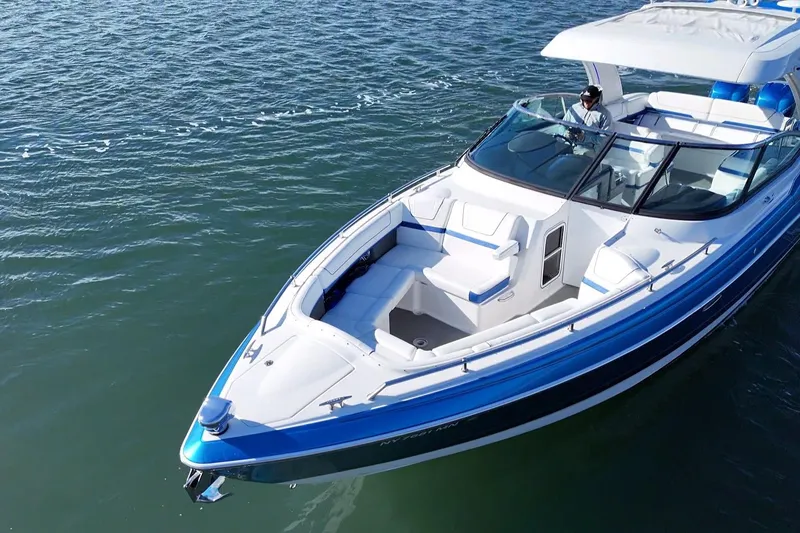 Slide: The Image of 2019 Formula 350 Crossover Bowrider OB cruising on open water. - 13