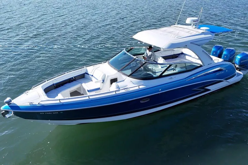 Slide: The Image of 2019 Formula 350 Crossover Bowrider OB on water, featuring sleek design and powerful engines. - 17