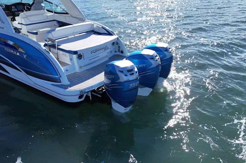 Slide: The Image of 2019 Formula 350 Crossover Bowrider OB with twin Mercury outboard engines on water. - 18