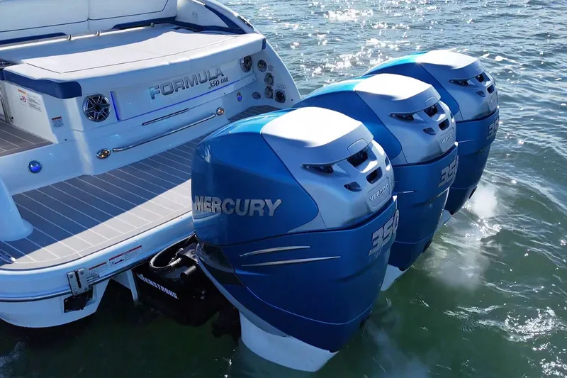 Slide: The Image of 2019 Formula 350 Crossover Bowrider OB with triple Mercury outboard engines on water. - 19