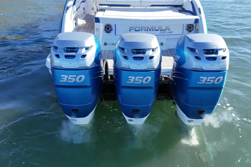 Slide: The Image of 2019 Formula 350 Crossover Bowrider OB with triple Mercury 350 engines on water. - 20