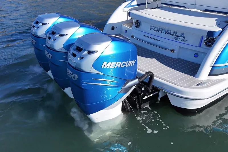 Slide: The Image of 2019 Formula 350 Crossover Bowrider OB with triple Mercury outboard engines on water. - 21