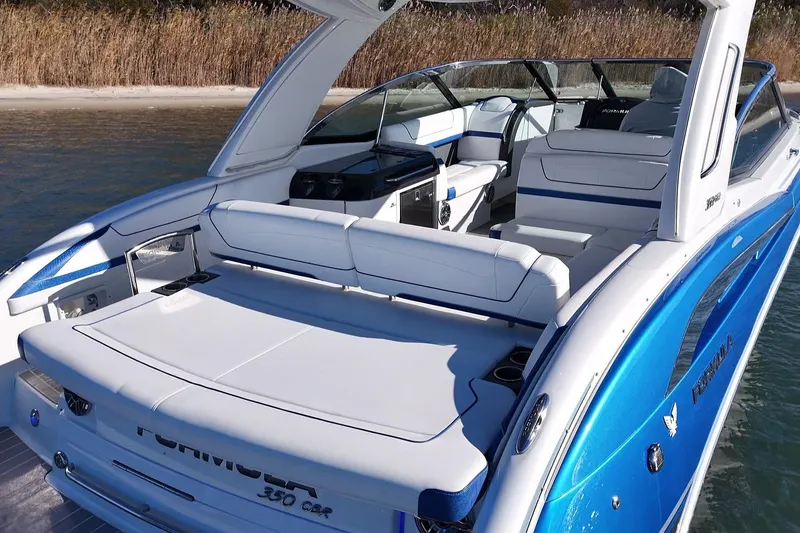 Slide: The Image of 2019 Formula 350 Crossover Bowrider OB, luxurious seating, sleek design, waterfront setting. - 23