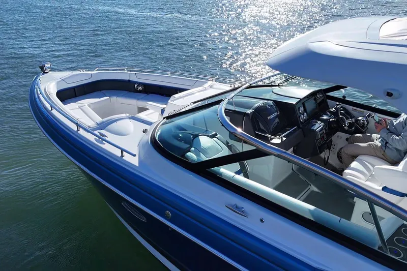 Slide: The Image of 2019 Formula 350 Crossover Bowrider OB on water, showcasing sleek design and spacious seating. - 25