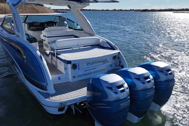 Slide: The Image of 2019 Formula 350 Crossover Bowrider OB with triple Mercury 350 engines on water. - 3