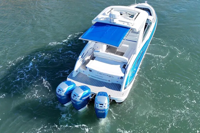 Slide: The Image of 2019 Formula 350 Crossover Bowrider OB with triple outboard engines on water. - 31