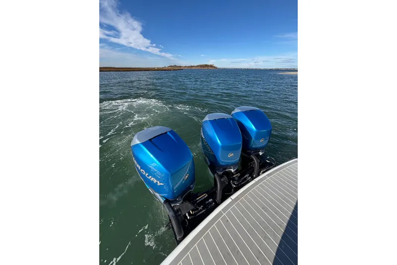 Slide: The Image of 2019 Formula 350 Crossover Bowrider OB with triple Mercury outboard engines on open water. - 34