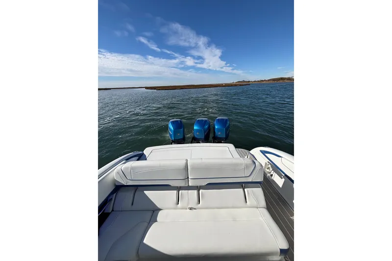 Slide: The Image of 2019 Formula 350 Crossover Bowrider OB on water, featuring triple outboard engines. - 38