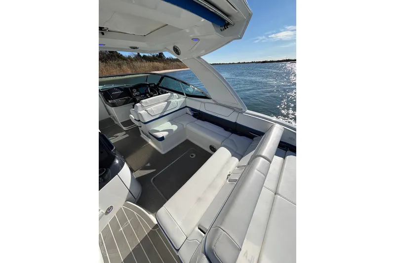 Slide: The Image of 2019 Formula 350 Crossover Bowrider OB interior with luxurious seating and scenic water view. - 39