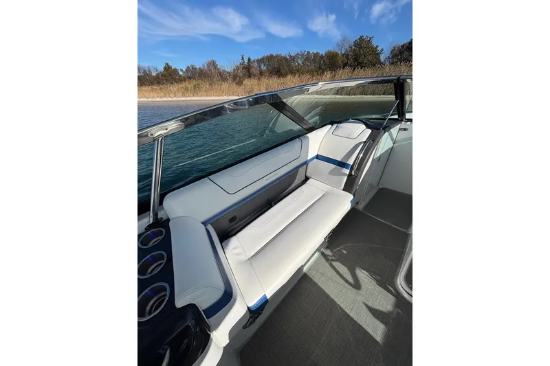 Slide: The Image of 2019 Formula 350 Crossover Bowrider OB interior with white seating and scenic water view. - 41