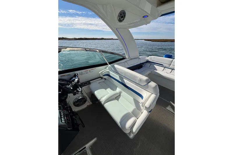 Slide: The Image of 2019 Formula 350 Crossover Bowrider OB interior with luxurious seating and scenic water view. - 44