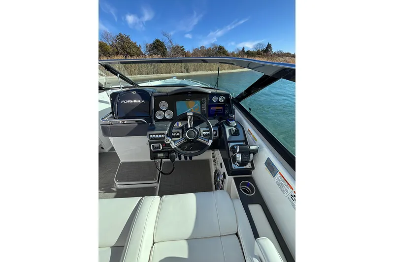 Slide: The Image of 2019 Formula 350 Crossover Bowrider OB cockpit with modern controls and steering wheel. - 48