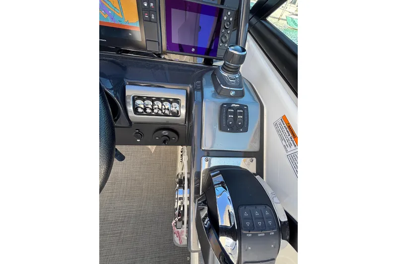 Slide: The Image of 2019 Formula 350 Crossover Bowrider OB helm with advanced controls and navigation display. - 52