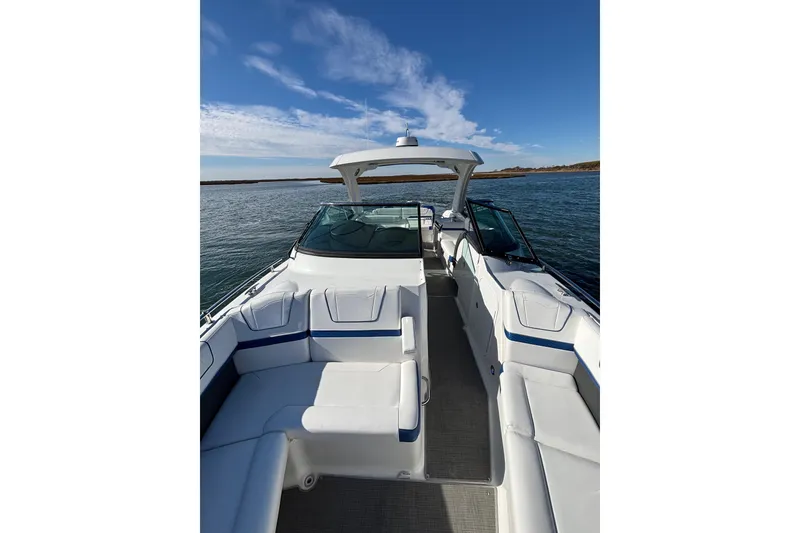 Slide: The Image of 2019 Formula 350 Crossover Bowrider OB on calm water, showcasing spacious seating and sleek design. - 59