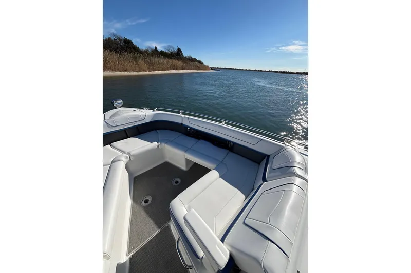 Slide: The Image of 2019 Formula 350 Crossover Bowrider OB on serene water, featuring spacious seating. - 60