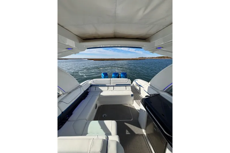 Slide: The Image of 2019 Formula 350 Crossover Bowrider OB interior with spacious seating and scenic water view. - 63