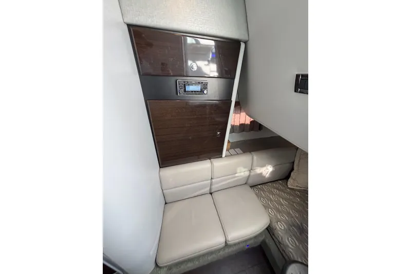 Slide: The Image of 2019 Formula 350 Crossover Bowrider OB cabin interior with seating and control panel. - 69