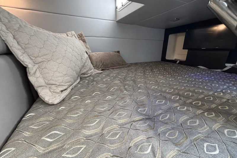 Slide: The Image of 2019 Formula 350 Crossover Bowrider OB cabin with cozy bedding and modern design. - 70