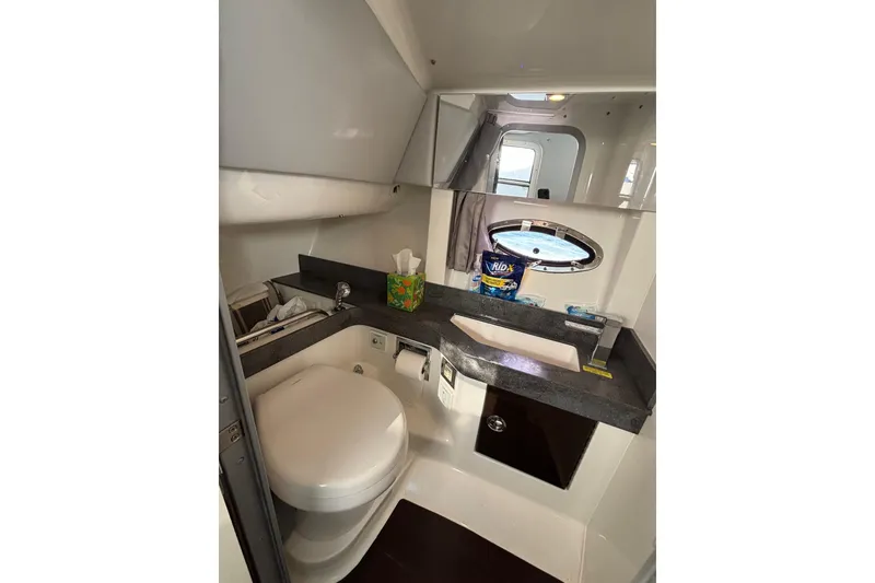 Slide: The Image of 2019 Formula 350 Crossover Bowrider OB bathroom with modern amenities and sleek design. - 72