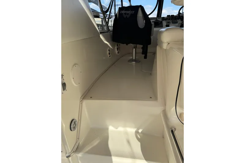 Slide: The Image of 1997 Sea Ray 370 Aft Cabin interior with seating and helm area. - 13