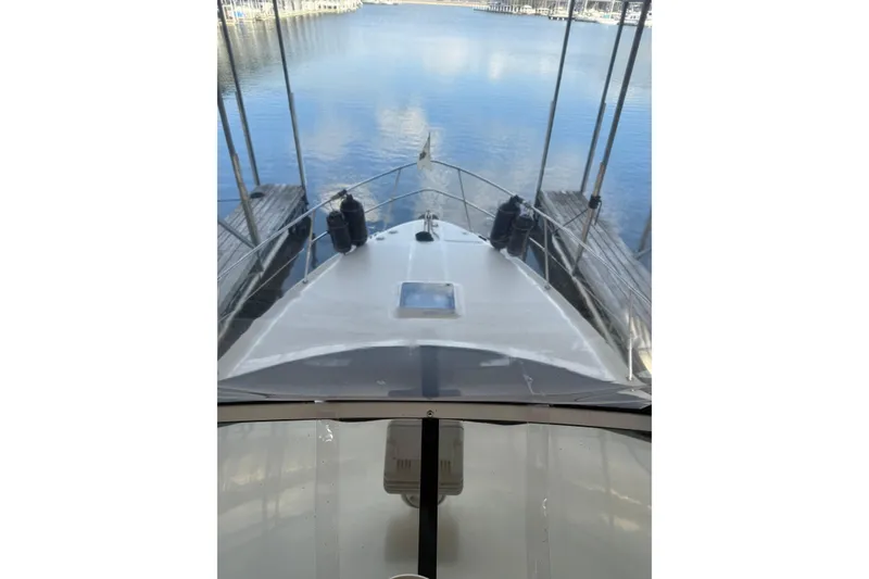 Slide: The Image of 1997 Sea Ray 370 Aft Cabin yacht docked at marina, view from helm. - 21
