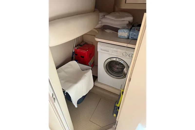 Slide: The Image of Laundry area in 1997 Sea Ray 370 Aft Cabin with washer and storage. - 34