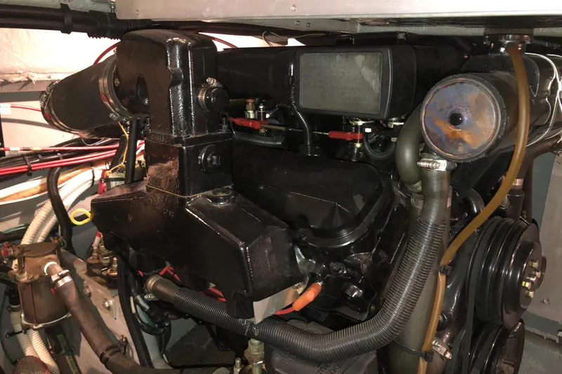 Slide: The Image of Engine compartment of a 1997 Sea Ray 370 Aft Cabin boat, showcasing mechanical components. - 63