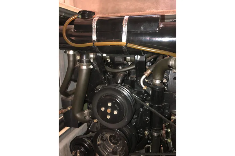 Slide: The Image of Engine compartment of a 1997 Sea Ray 370 Aft Cabin boat, showing hoses and components. - 66