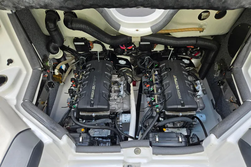 Slide: The Image of Engine compartment of 2013 Yamaha Boats 212X, featuring dual high-output engines. - 10