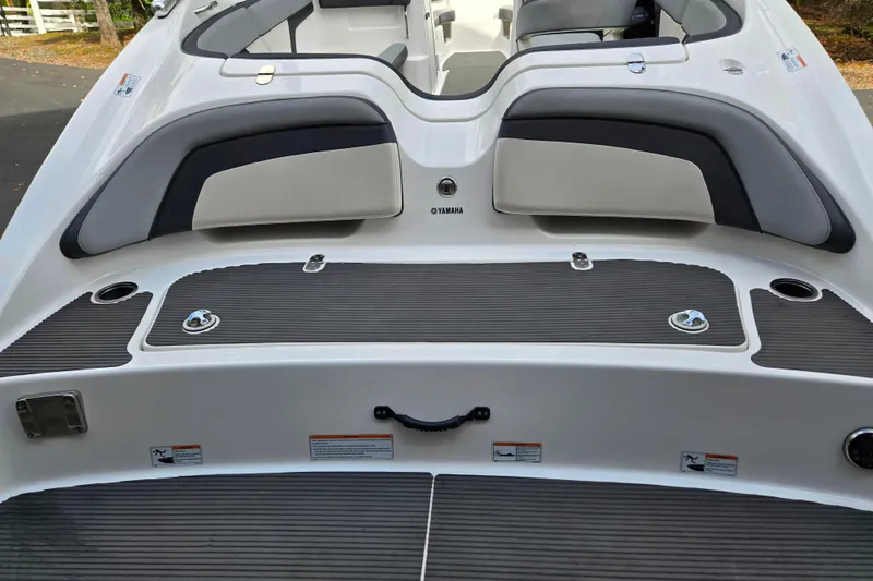 Slide: The Image of 2013 Yamaha Boats 212X swim platform with cushioned seating and sleek design. - 13