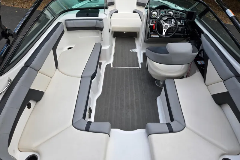 Slide: The Image of Interior of 2013 Yamaha Boats 212X, featuring spacious seating and modern dashboard. - 3
