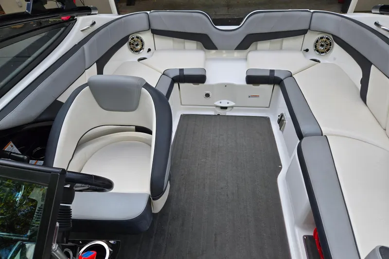 Slide: The Image of Interior of 2013 Yamaha Boats 212X, featuring sleek seating and modern design. - 9
