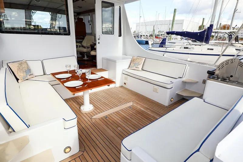 Slide: The Image of Luxurious 2005 New England Boatworks Downeast Sedan with elegant seating and dining area. - 23