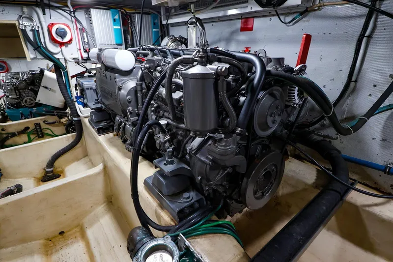 Slide: The Image of Engine room of 2005 New England Boatworks Downeast Sedan, showcasing detailed mechanical components. - 41