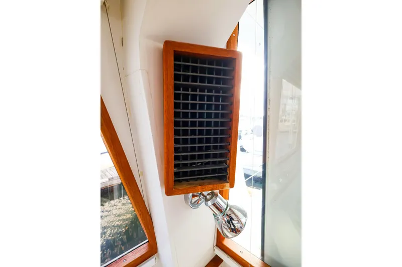 Slide: The Image of Wooden vent and light fixture inside 2005 New England Boatworks Downeast Sedan. - 25