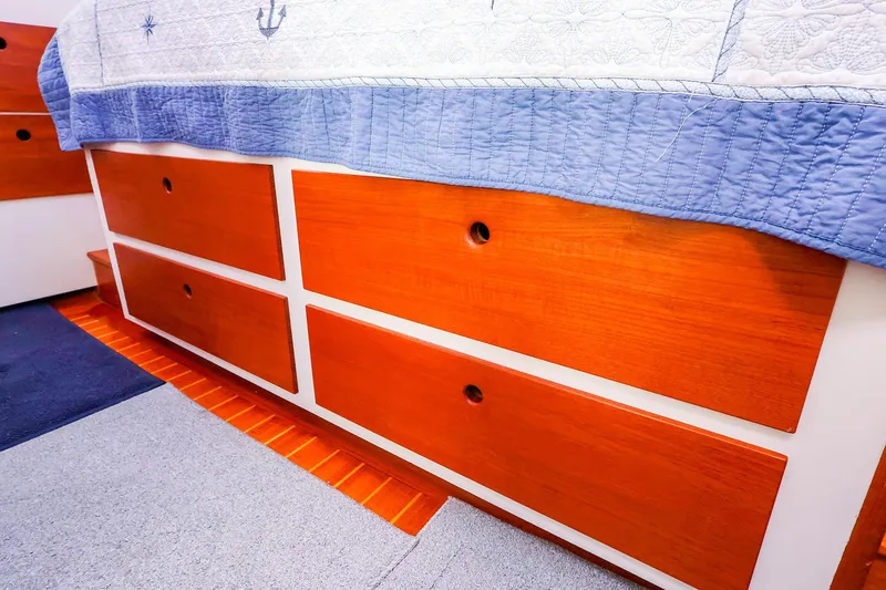 Slide: The Image of Wooden drawers in a 2005 New England Boatworks Downeast Sedan interior. - 36