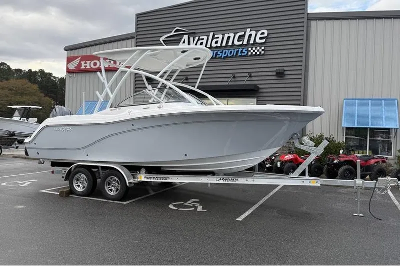 Slide: The Image of 2026 Sea Fox 228 Traveler boat on trailer at Avalanche Motorsports dealership. - 2